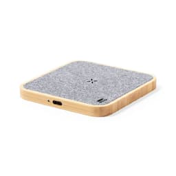 A wireless charger with a grey fabric surface and a bamboo wood base, featuring a logo on the side.