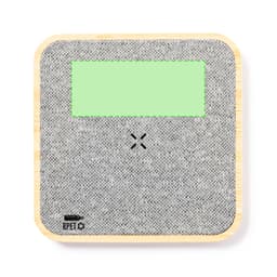A wireless charger featuring a grey textured surface with a green area, backed by a bamboo base and a logo.