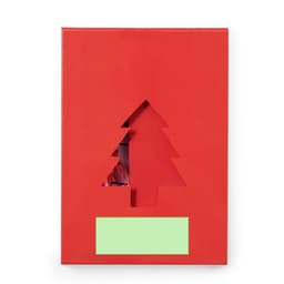 A red gift box featuring a cut-out Christmas tree design, with a green label area on the front.