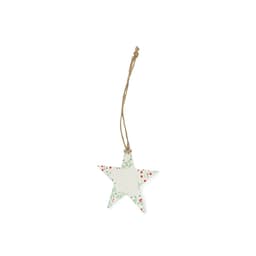 A decorative star-shaped tag in white with green and red floral patterns, hanging from a jute string.