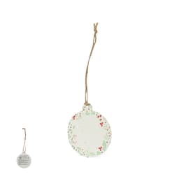 A circular decorative tag with a floral design in green and red, featuring a hanging twine.