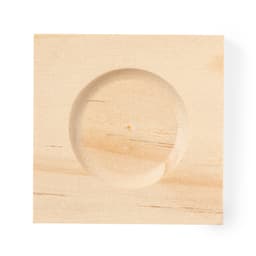 A wooden sand timer base with a circular indentation in a light wood finish.