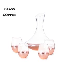 A glass decanter with a curved shape and four copper-hued stemless glasses.
