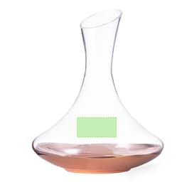 A glass decanter with a curved design and a copper base, featuring a blank label.