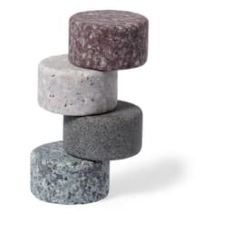 A stack of four round stone ice cubes in grey, white, maroon, and green hues, featuring a smooth texture.