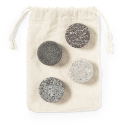 A drawstring bag containing four stone ice cubes in various shades of grey and black.