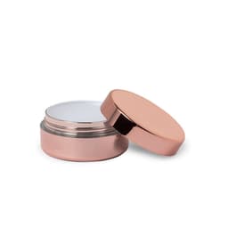 A lip balm in a rose gold container with a removable lid, featuring a smooth, clear balm inside.