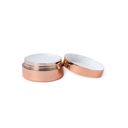 A rose gold lip balm container with a white interior, featuring a shiny lid and a smooth base.