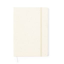 A cream-coloured notebook with speckled design, featuring an elastic band closure and a bookmark ribbon.
