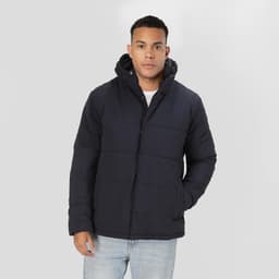 A dark navy rain jacket with a hood displayed on a model, featuring a puffer design and a logo.