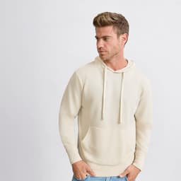 A beige hoodie with a kangaroo pocket and drawstring hood, featuring a small logo on the front.