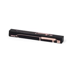 A metal pen in a sleek black and rose gold design, presented in an elongated box with a logo.