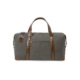 A grey bag made of durable fabric with brown leather accents and handles, featuring a front zip pocket and detachable strap.