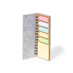 Aurat Notebook with a grey cover, featuring sticky notes in pink, white, yellow, and green in a spiral binding.