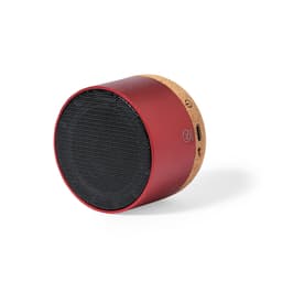 A red Bluetooth speaker with a cork base, featuring a textured mesh front and a branding logo.