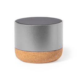 A Bluetooth speaker featuring a sleek silver top and a natural cork base, with a minimalist design and a branding logo.