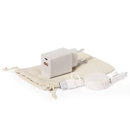 A grey charging block and cable set, including a round wireless charger, packaged in a cream drawstring bag.