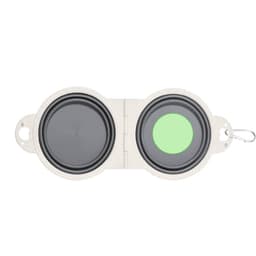A foldable bowl with a grey interior and a green base, featuring a clip for easy attachment. Contains a logo.