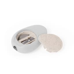 A grey pencil sharpener with a removable lid, featuring a metal blade for sharpening pencils.
