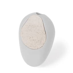 A grey pencil sharpener with a speckled beige top and a logo.