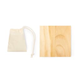 A natural wooden square piece beside a small beige drawstring pouch.