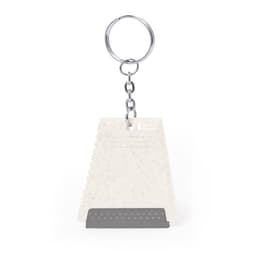 A white ice scraper keyring with a silver chain and a metal scraping edge. It features a small logo.