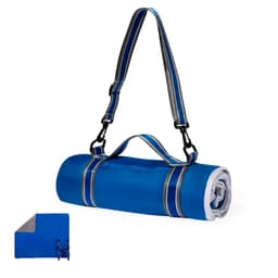 A blue picnic blanket rolled up with a carrying strap, featuring a grey underside and a logo on the surface.