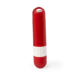 A red lip balm container with a white band, featuring a circular opening on top.
