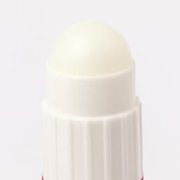 A white lip balm stick with a rounded top, showcasing its smooth surface and clean design.