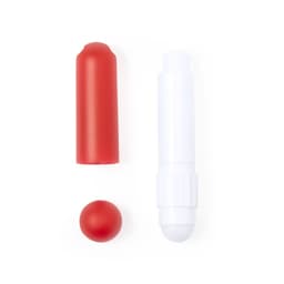 A red and white lip balm set, featuring a cylindrical balm with a cap and a round applicator, alongside a red ball.