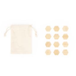 A cream drawstring bag alongside twelve hexagonal wooden tokens.