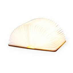 A lamp designed to resemble an open book, featuring a warm white light and a wooden base. It has a unique, foldable design.