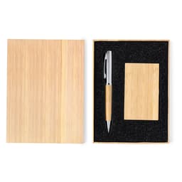 A bamboo notebook and pen set neatly packaged in a box with a black foam insert.
