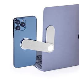 A silver phone holder attaches to a laptop, holding a blue smartphone securely in place.