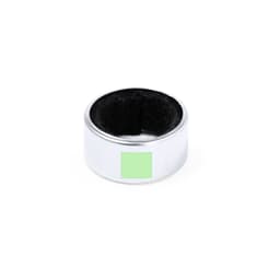 A metallic silver drink ring with a black felt lining, designed to prevent spills. Features a logo on the surface.