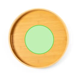 A round bamboo tray featuring a pale green centre and a natural wood finish. The tray has a smooth surface and raised edges.