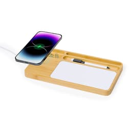 A bamboo wireless charger with compartments for a phone, a pen, and a notepad. The phone displays a purple screen.