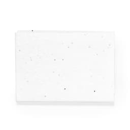A stack of white sticky notes with speckles, featuring a textured design, and a branding logo.