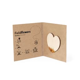 A brown paper gift set with heart-shaped seed holder and planting instructions for fieldflowers.
