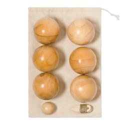 A set of six wooden balls in a natural finish, displayed on a beige fabric backing with a smaller ball and string.