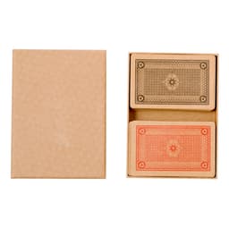 A cardboard box containing two sets of playing cards in orange and brown, with a decorative pattern.