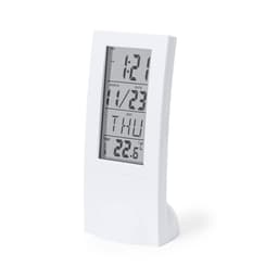 A white digital weather station display featuring time, date, day, and temperature readings.