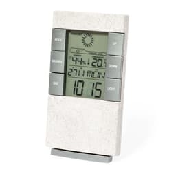 A weather station in a light grey design with a digital display and control buttons for settings and mode adjustments.