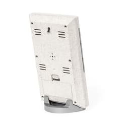 A weather station with a textured white back, featuring vents and a stand for support. It includes a small branding logo.