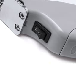 A grey device with a power switch, featuring a metallic panel and screws. The product appears sturdy and well-made.