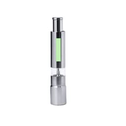 A sleek silver salt and pepper mill with a transparent section and a green accent. It features a modern design and a logo.