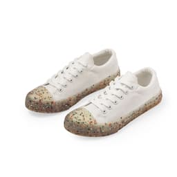 White sneakers with a speckled, multicoloured sole and classic lace-up design, featuring a logo on the side.