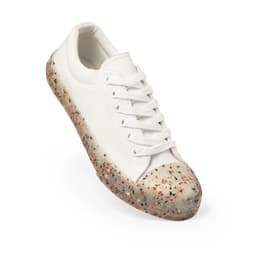 A white sneaker with a textured, colourful sole featuring a mix of shades and speckles. The shoe has a logo.