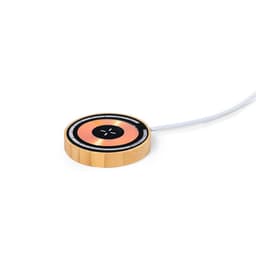 A wireless charger in gold with a circular design and a white cable attached. It features a logo on the surface.