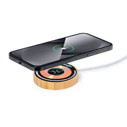 A wireless charger in a bamboo design with a black smartphone placed on top, highlighting its sleek style.